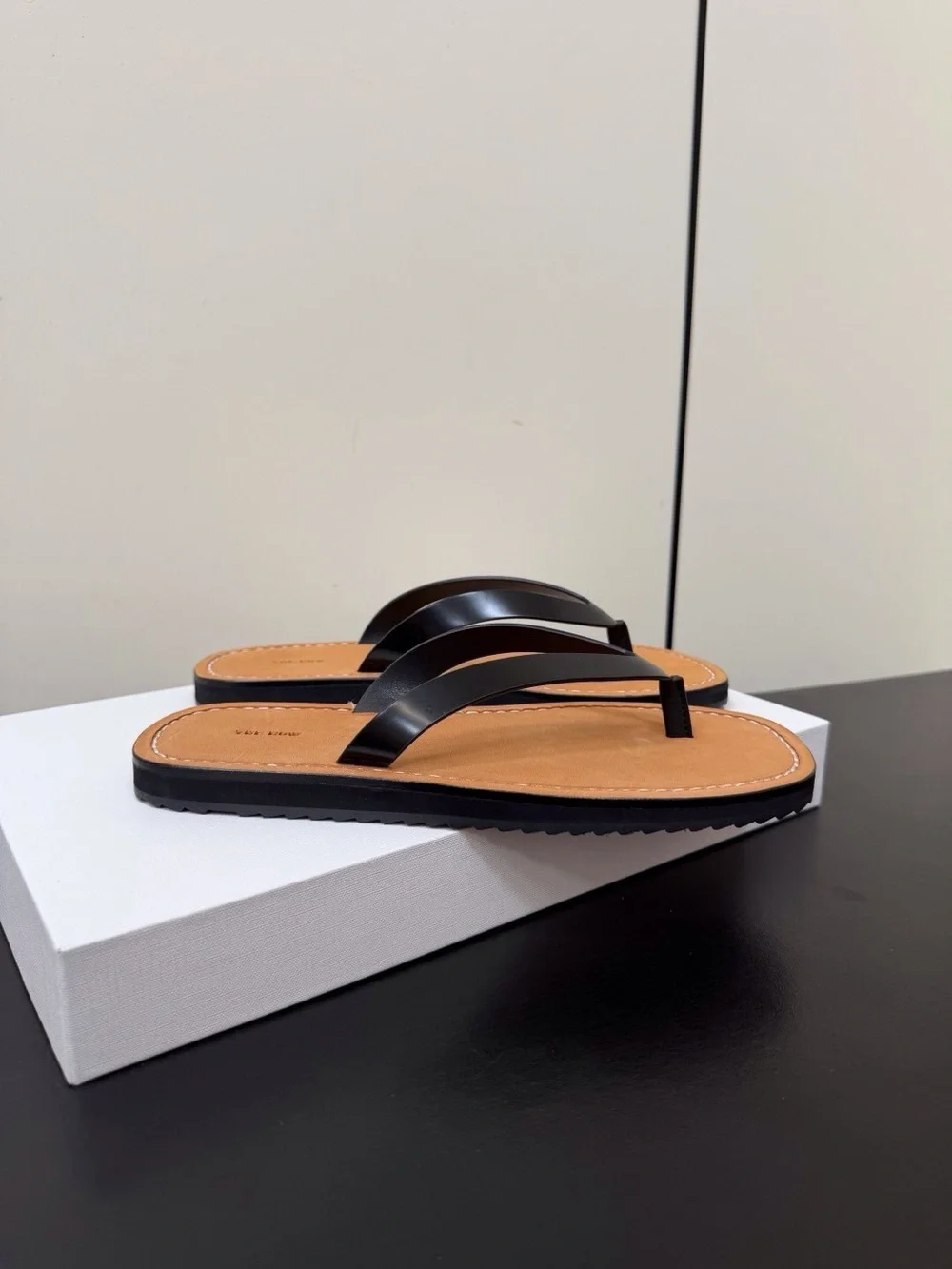 Women’s Tan Leather Flip-Flop Sandals with Black Straps